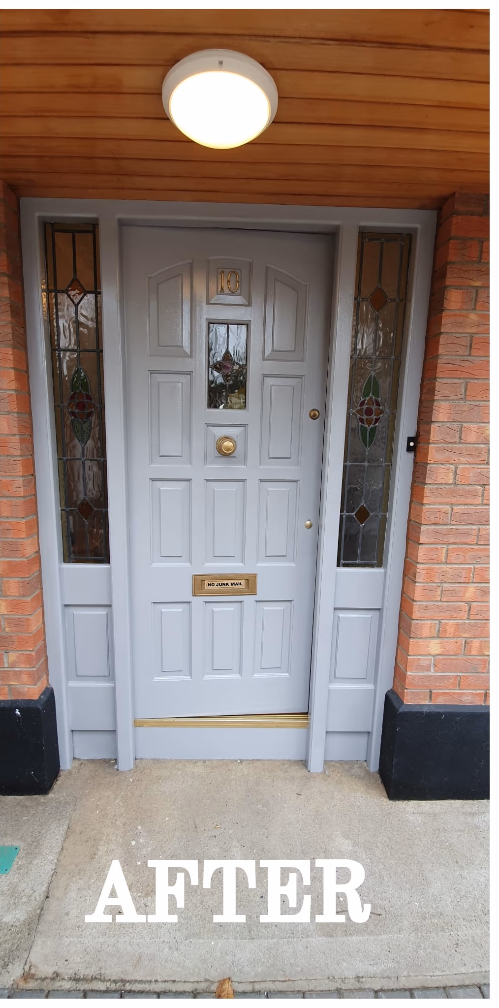 Period front door repainted grey with polished brass hardware in Dublin